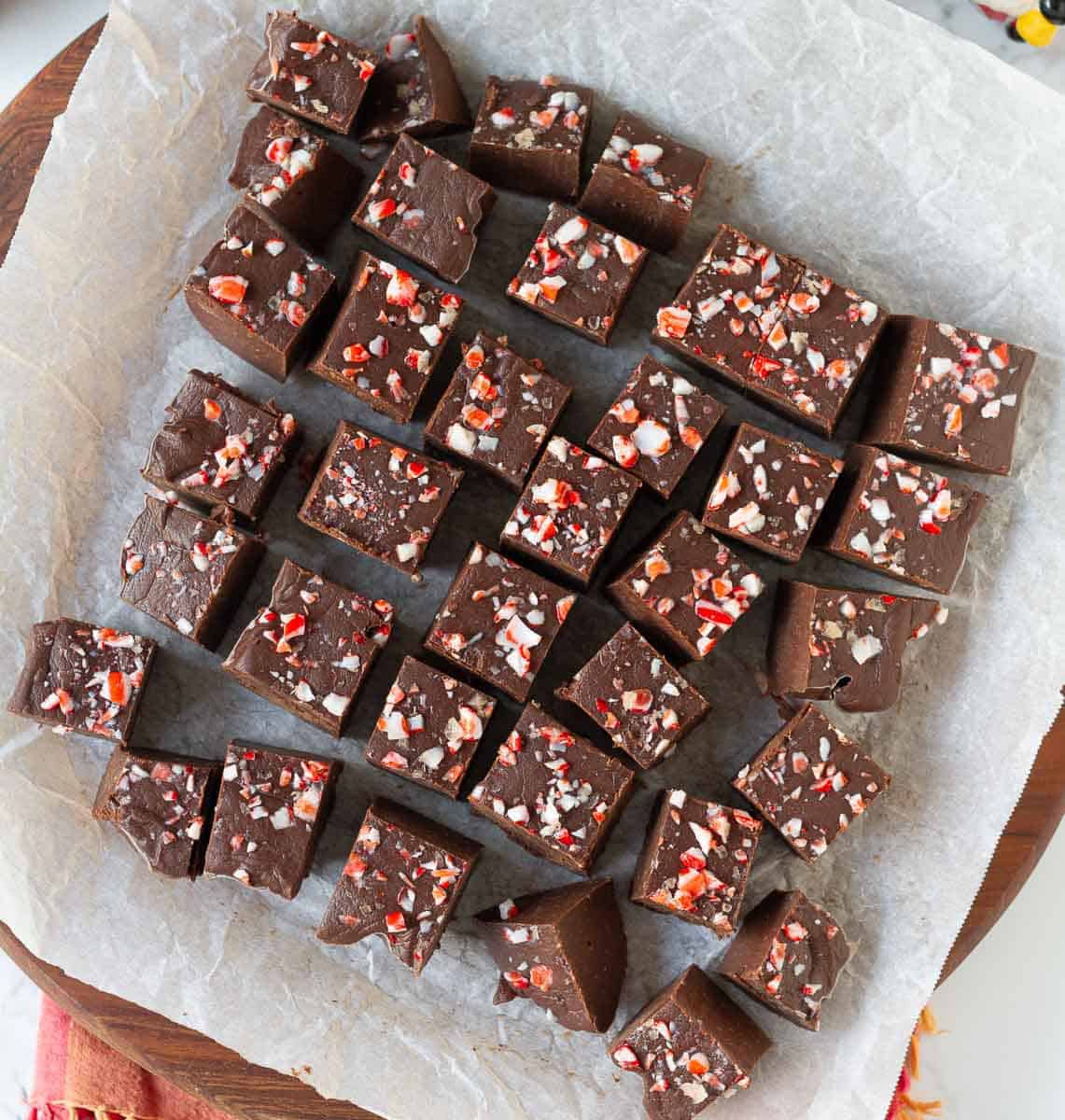 Fudge cut into squares on parchment paper.