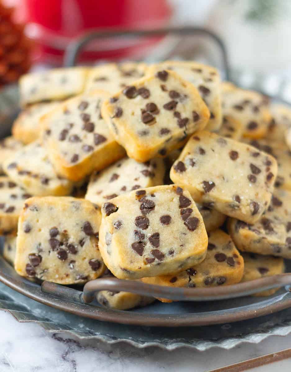 Chocolate chip cookies on a grey metal tray.