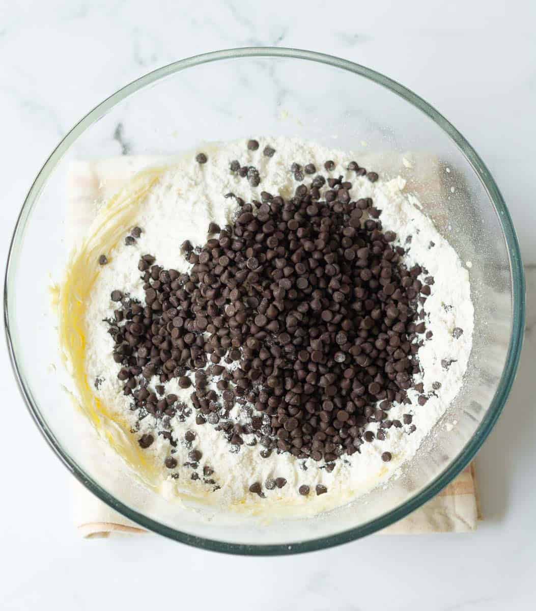 Flour and chocolate chip added to a mixture of butter and icing sugar.