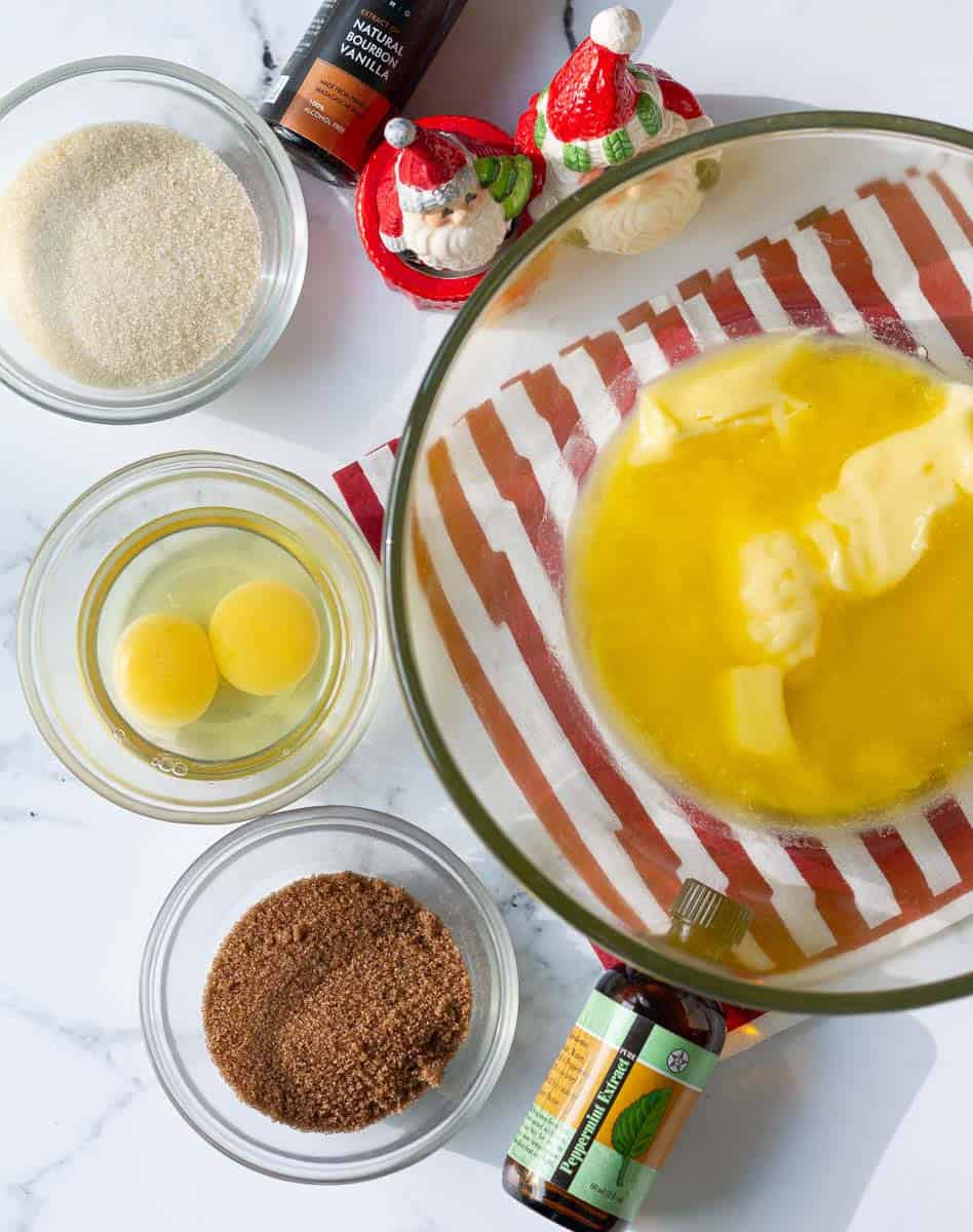 Butter, eggs, brown sugar, caster sugar for making the mint chocolate chip cookies