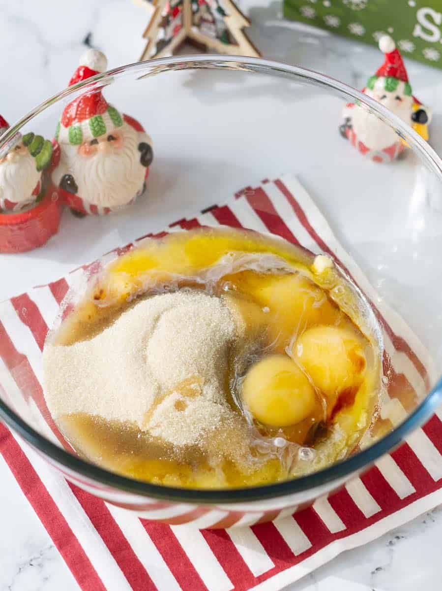 Mix eggs, butter, caster sugar, brown sugar in a bowl