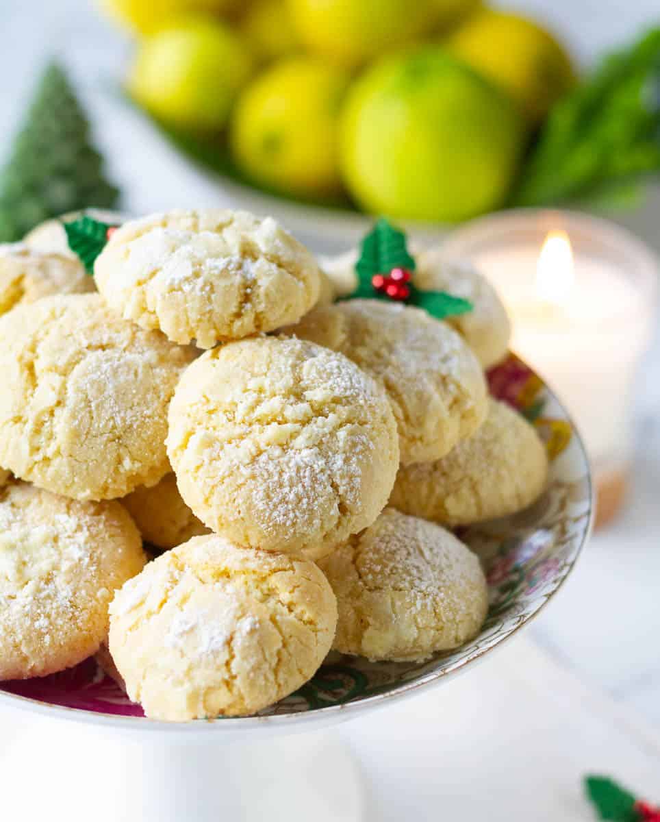 Lemon crinkle cookies on a serving platter.