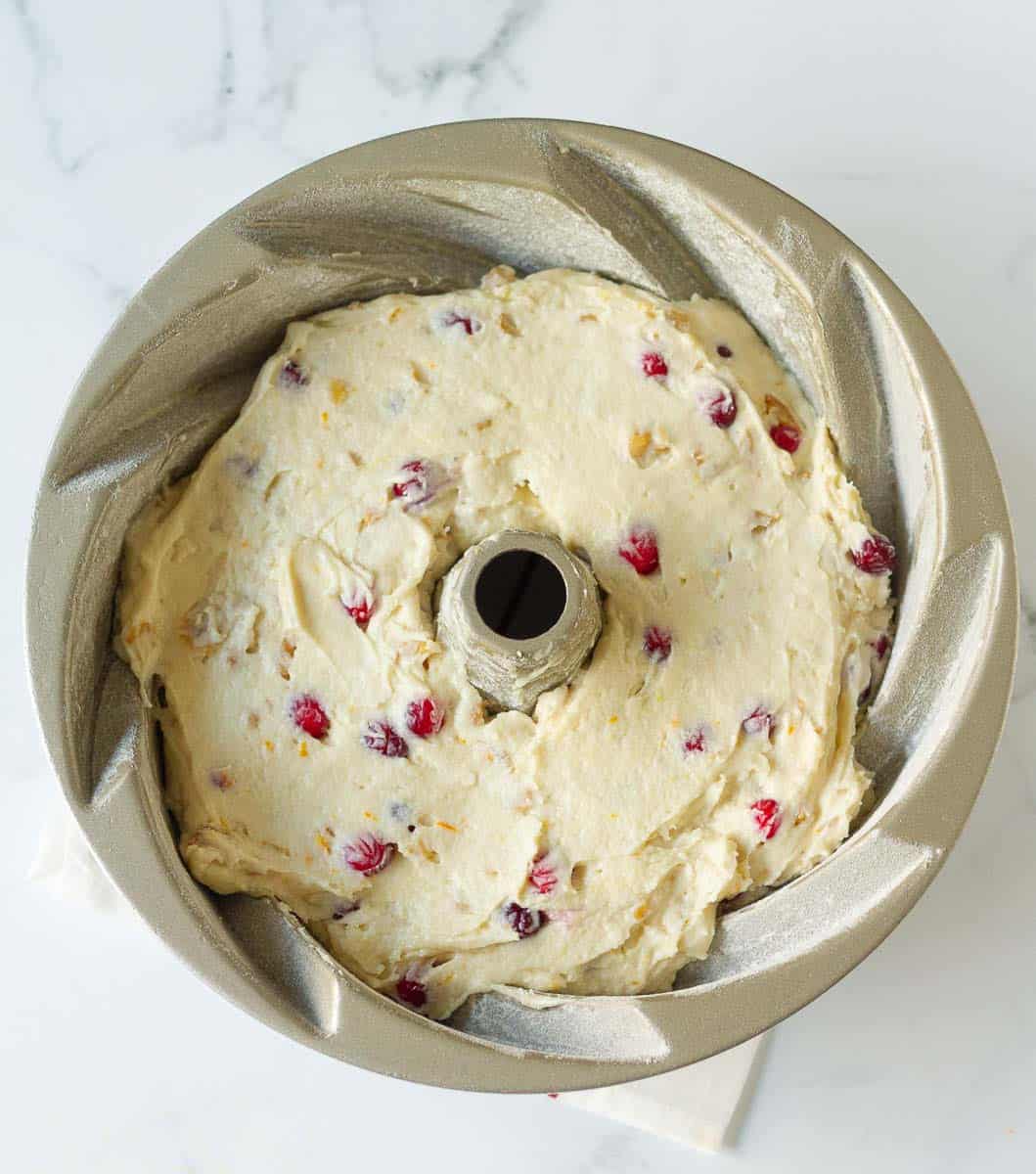 cranberry pound cake batter in a bundt pan
