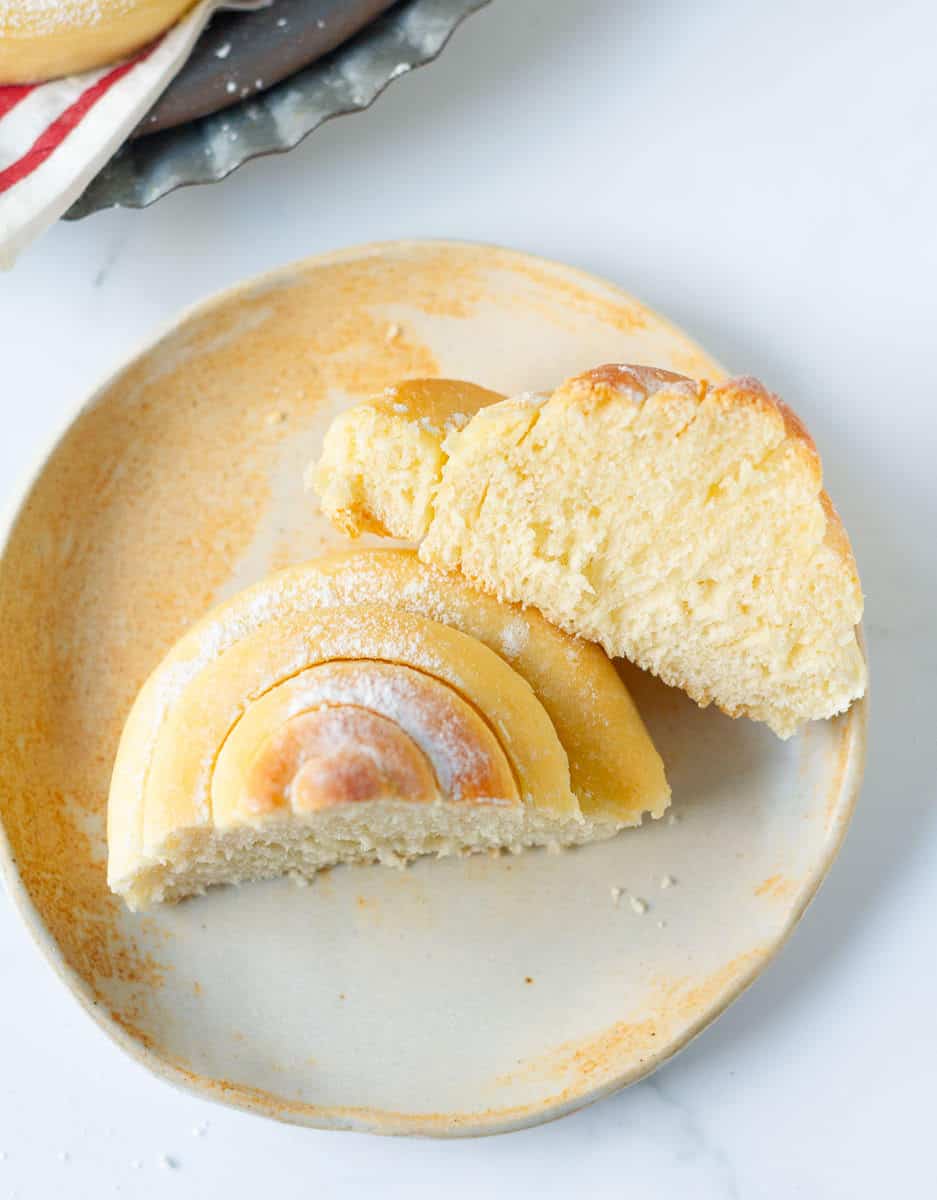 mallorca bread roll cut in half on a small plate
