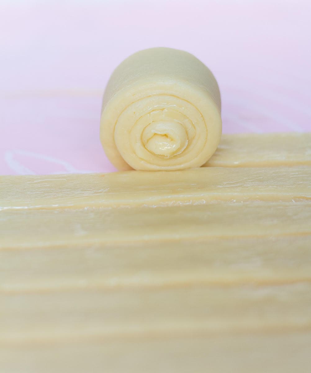 Roll each strip into a tight spiral