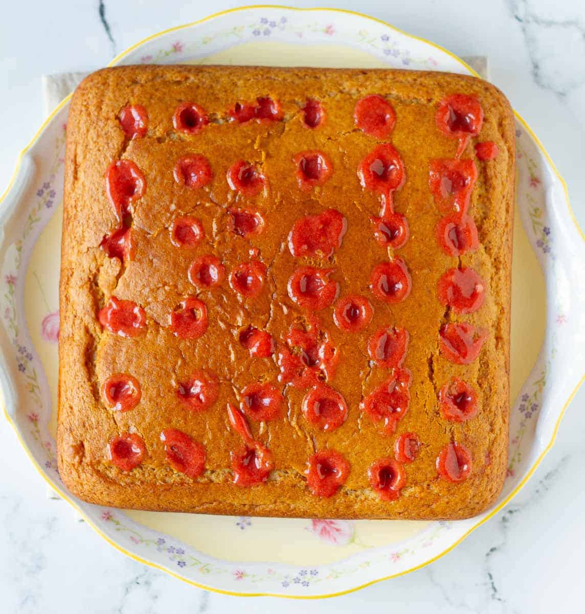 cake holes filled with strawberry syrup.