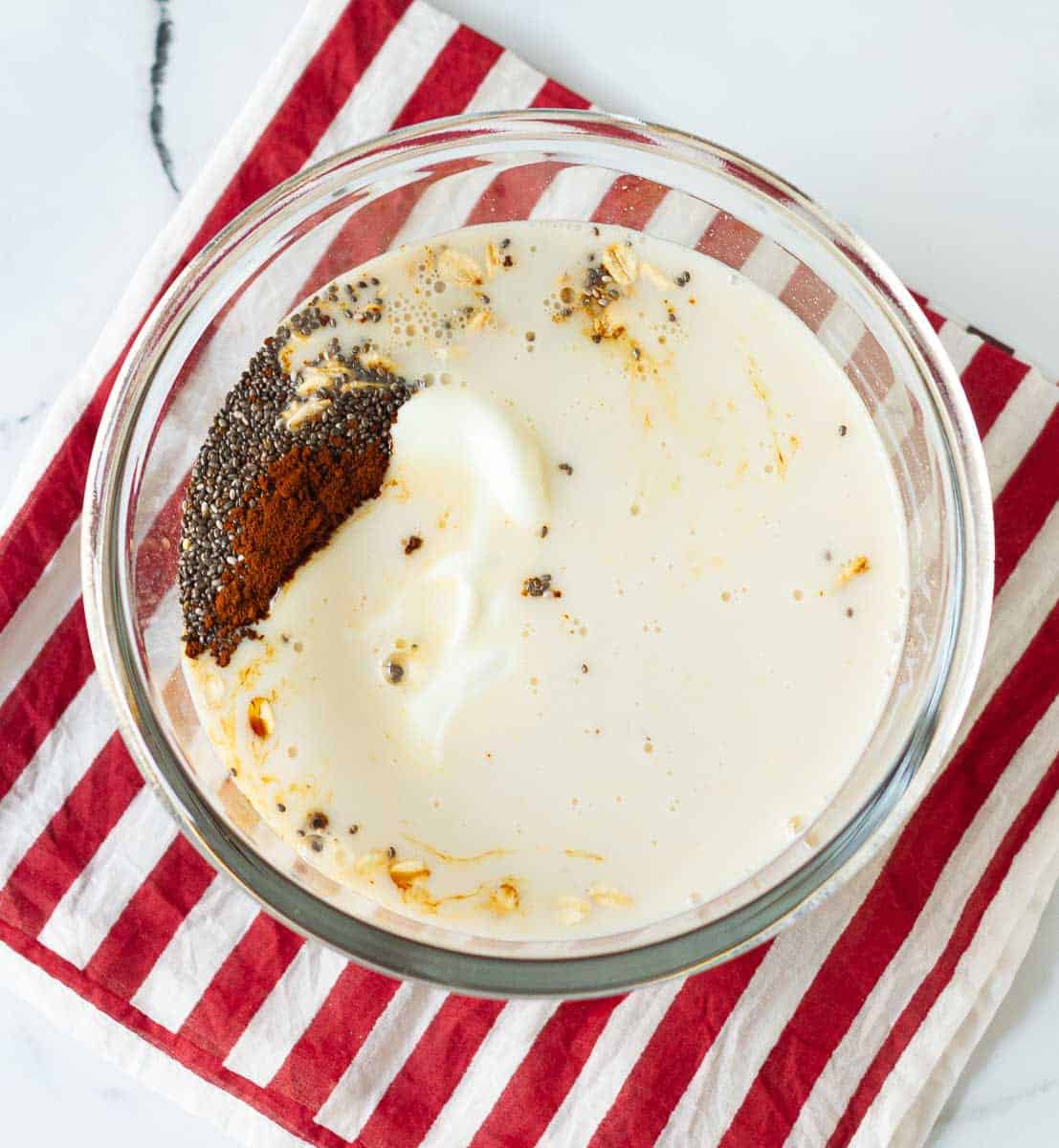 All ingredients in a bowl for making overnight oats