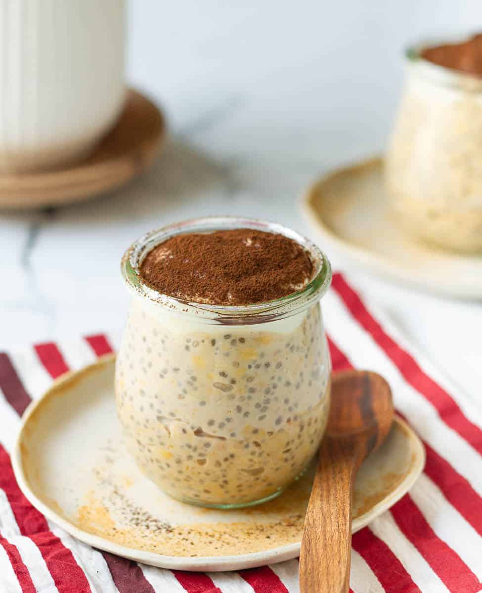 Tiramisu Overnight Oats topped with maple-flavored yogurt and cocoa powder