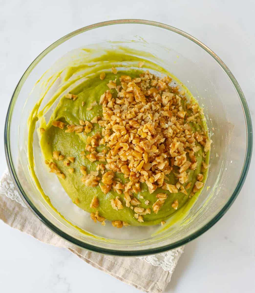 Folding walnuts into the batter
