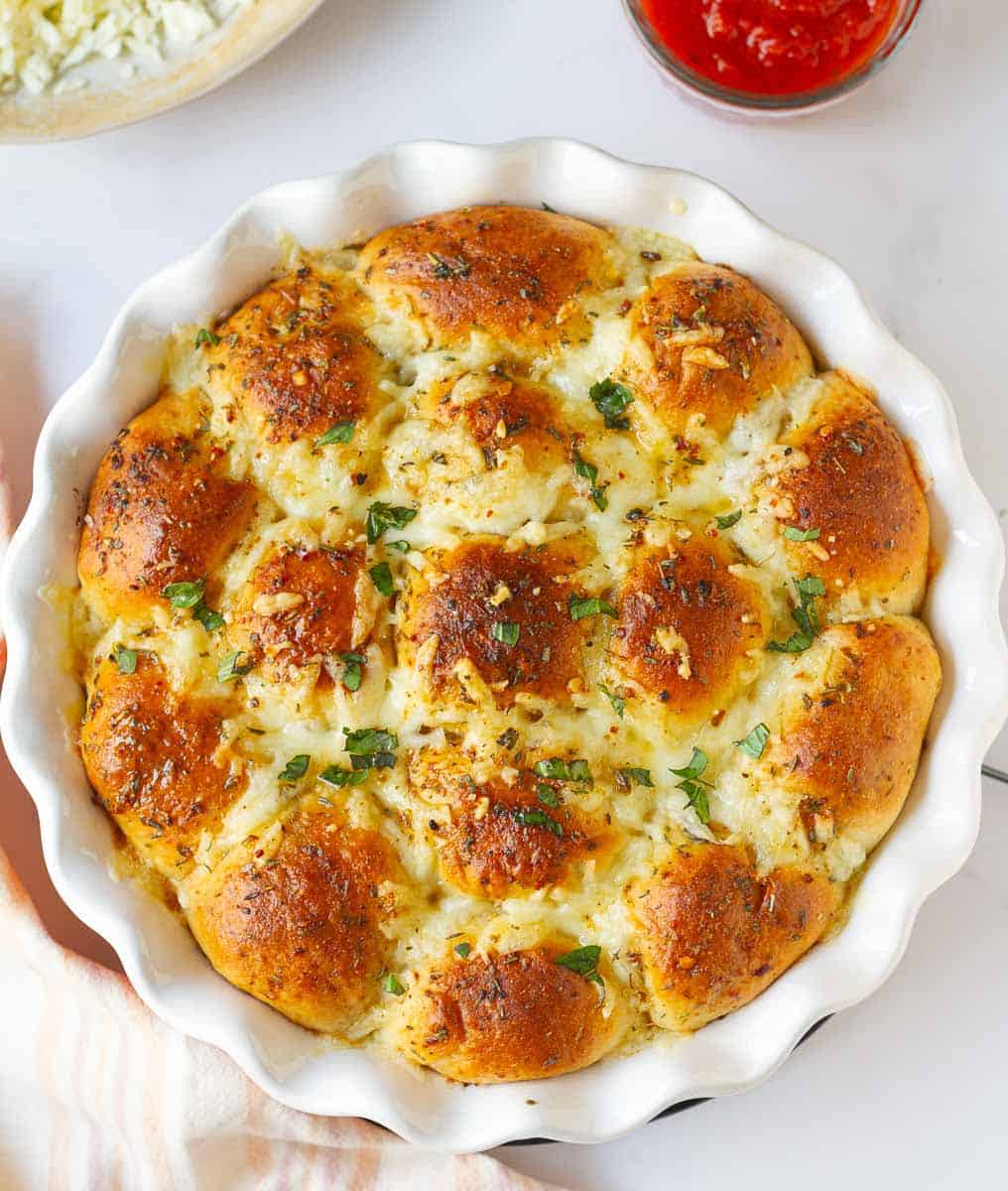 Baked pizza pull-apart bread in a pan.