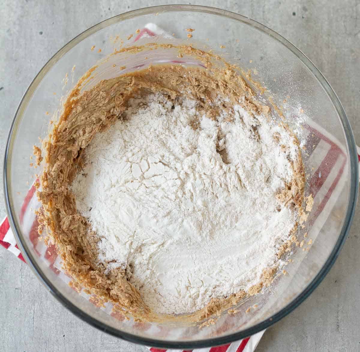 Dry and wet ingredients for oatmeal cookies in a bowl.