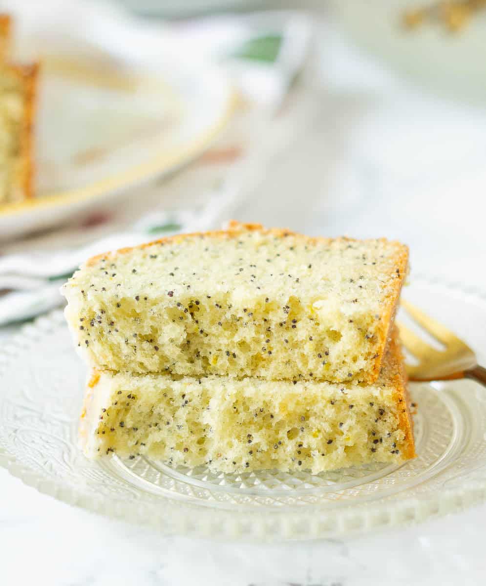 Lemon Poppy Seed Bread slice cut in half on a small plate.
