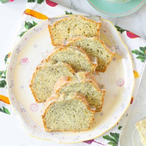 Sliced poppyseed bread on a platter.