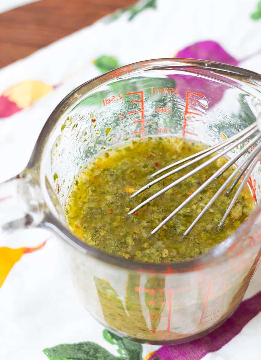 whisking the ingredients for Italian Salad