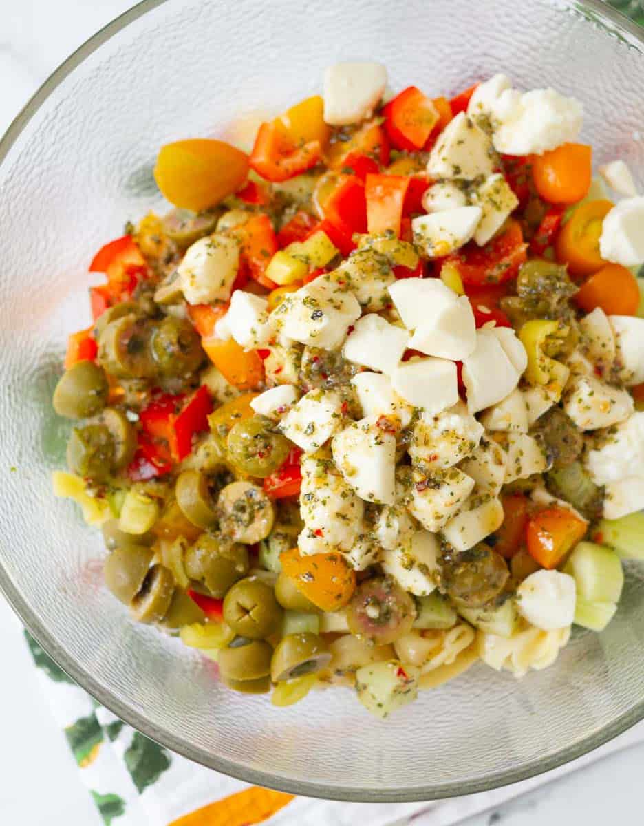 Pour the italian dressing on top of the Italian Tortellini Pasta Salad