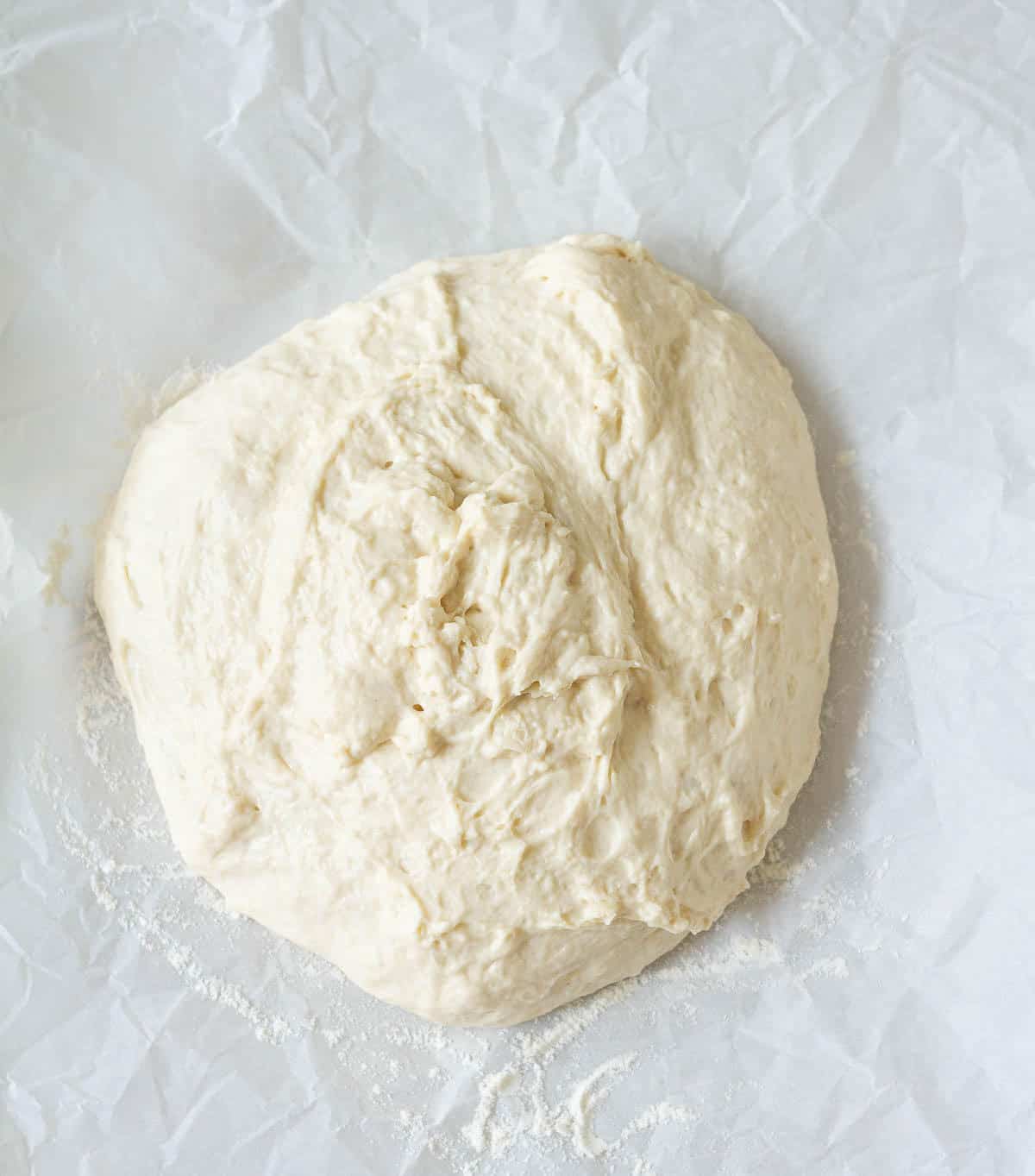 Bread dough on parchment paper.