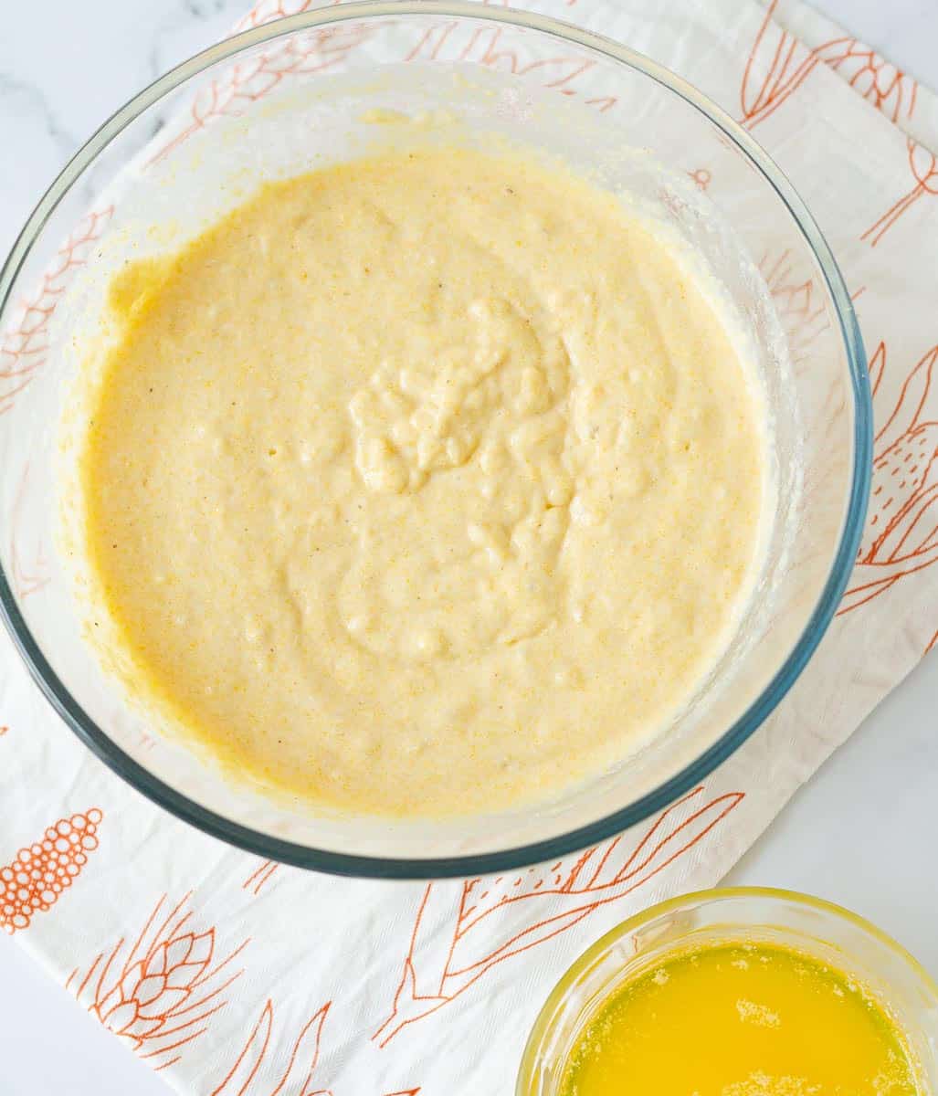 Mix all the ingredients for making cornbread in a large glass bowl.