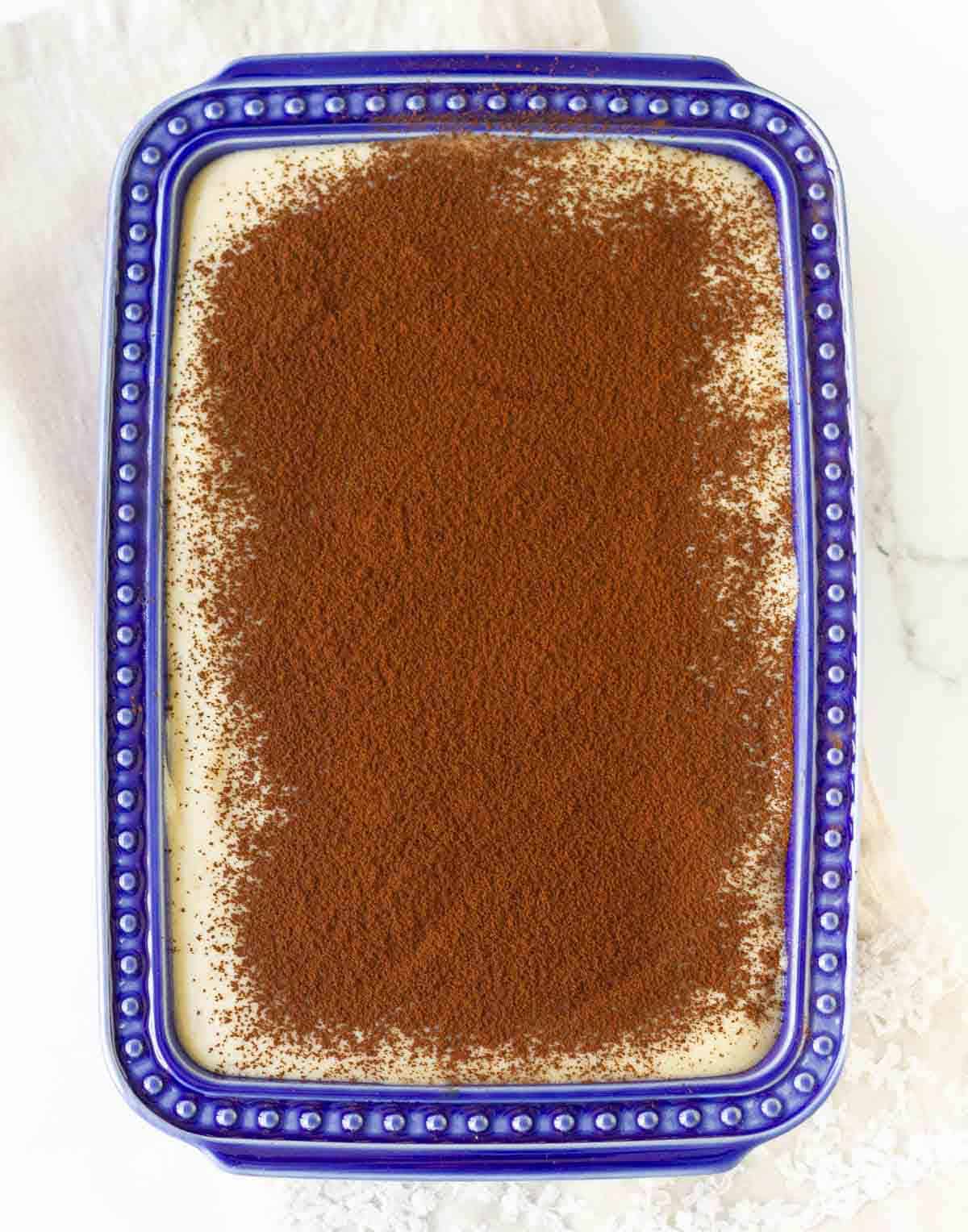 Chai spiced tiramisu dusted with cocoa powder.