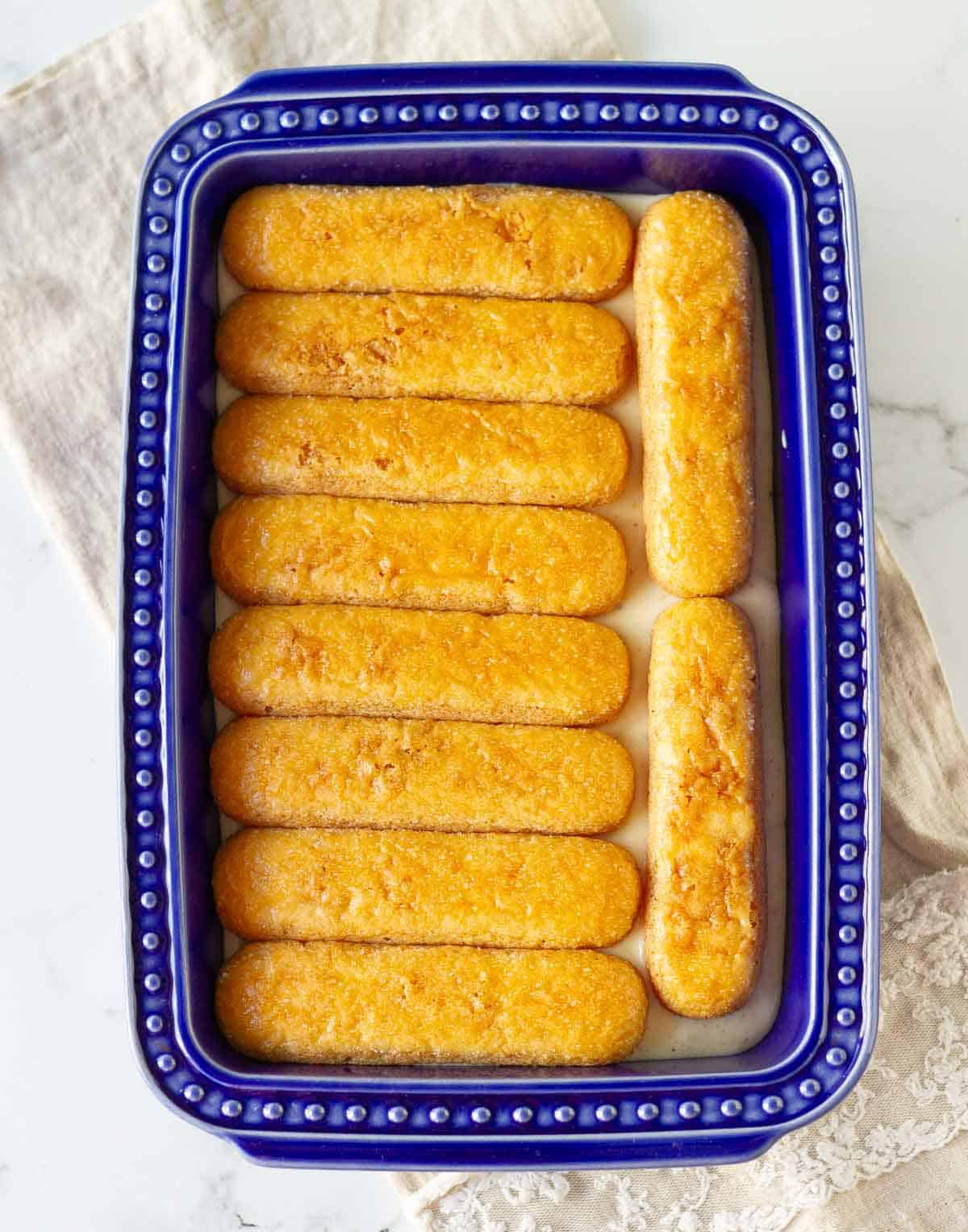 Layer of chai soaked ladyfingers on top of whipped mascarpone.