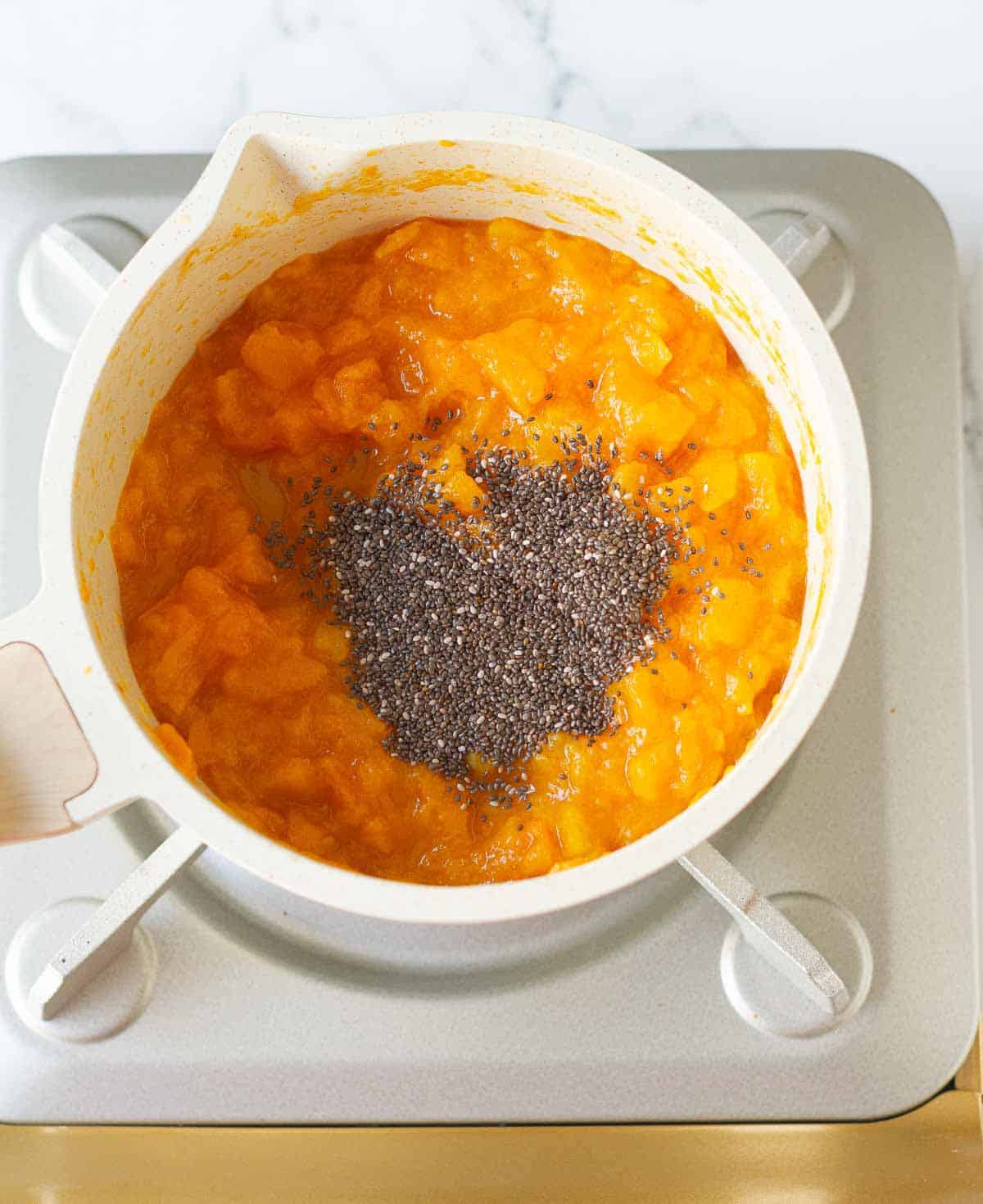 chia seeds on the cooked, mashed persimmons.