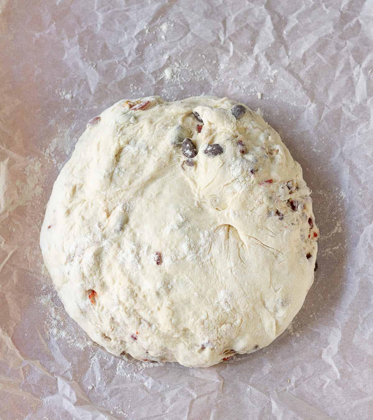 bread dough on top of parchment paper.