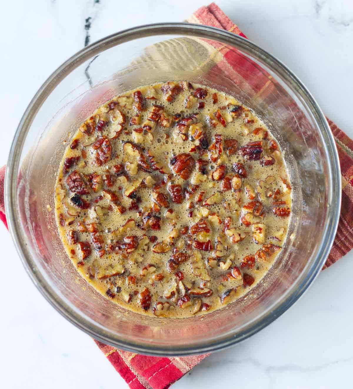 pecans in the eggs, sugar, butter pie filling mixture.