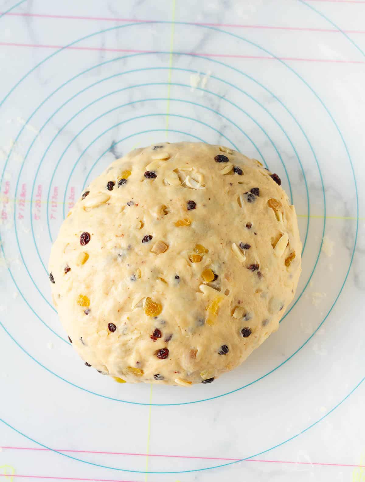kneaded stollen dough on a silicone mat.