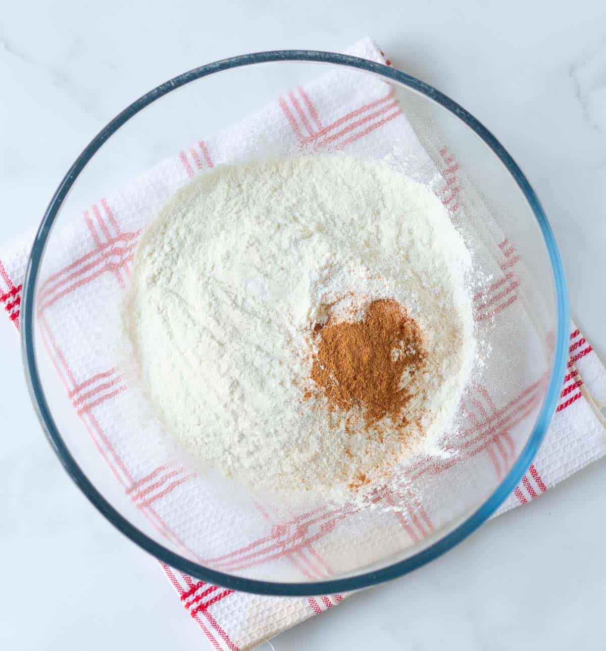 Dry ingredients for fig bread in a mixing bowl.