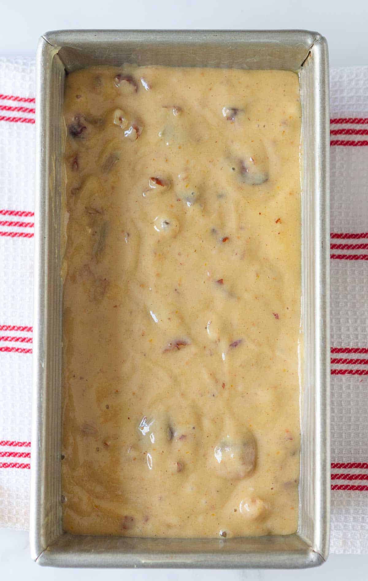 Fig bread batter in a loaf pan.