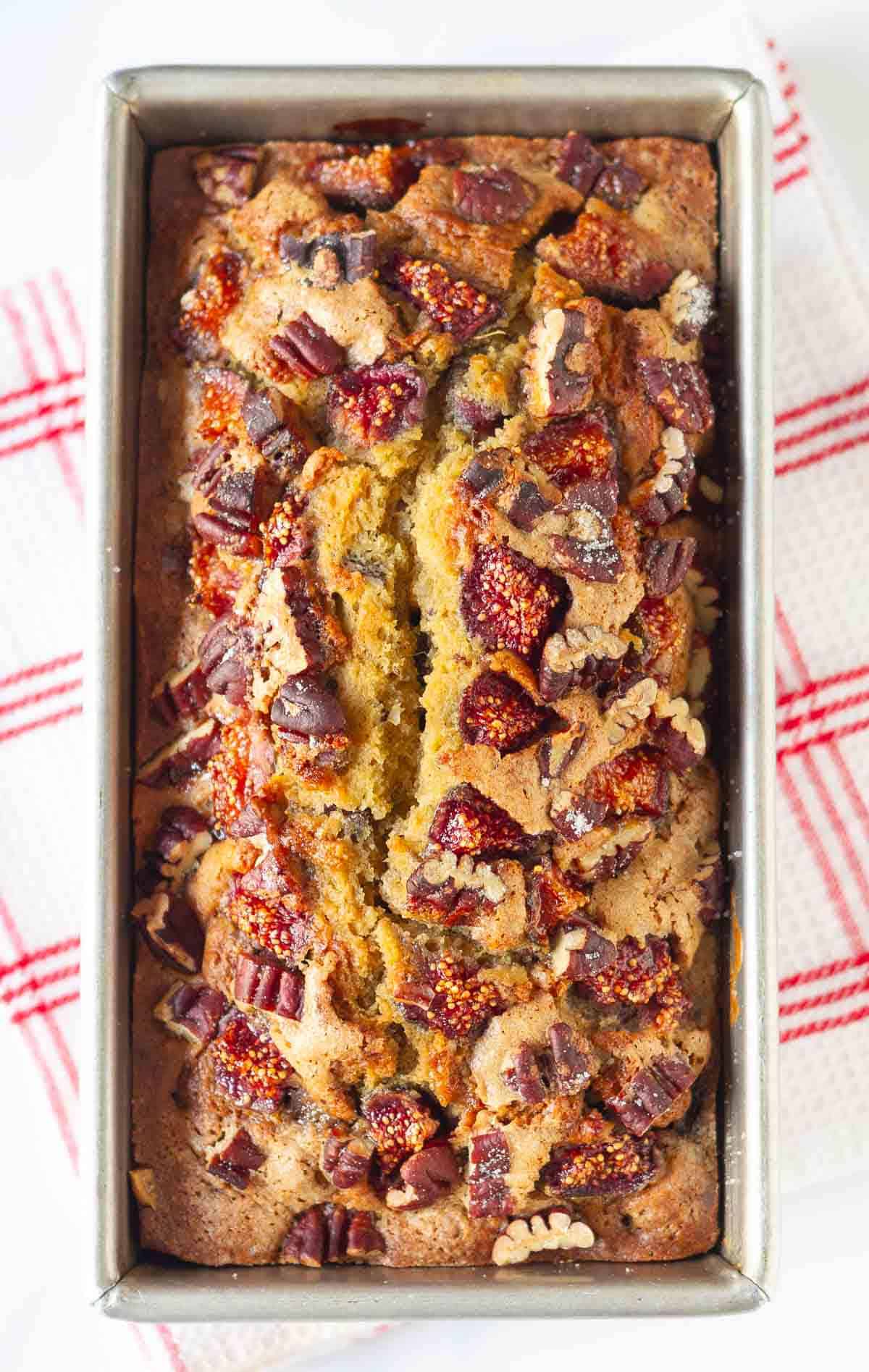 Baked fig bread in a loaf pan.