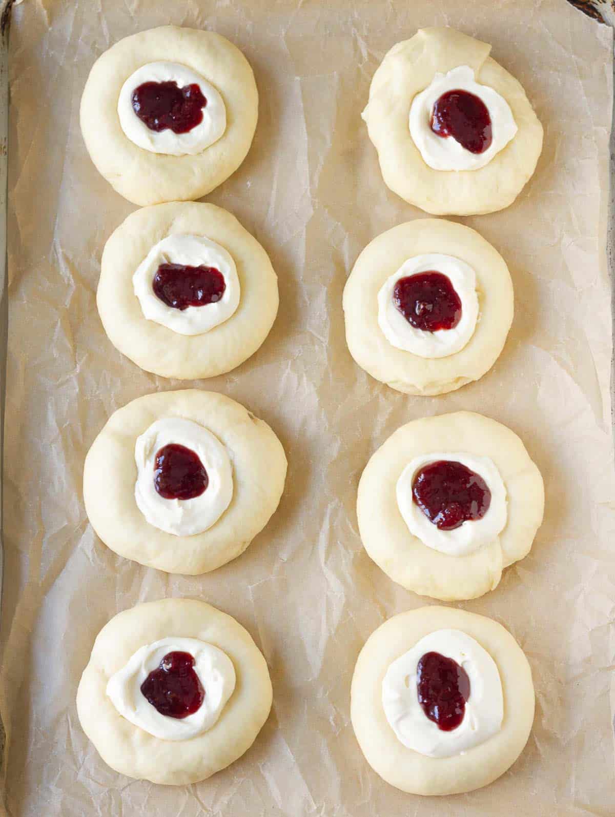 Dough balls filled with cream cheese and jam.