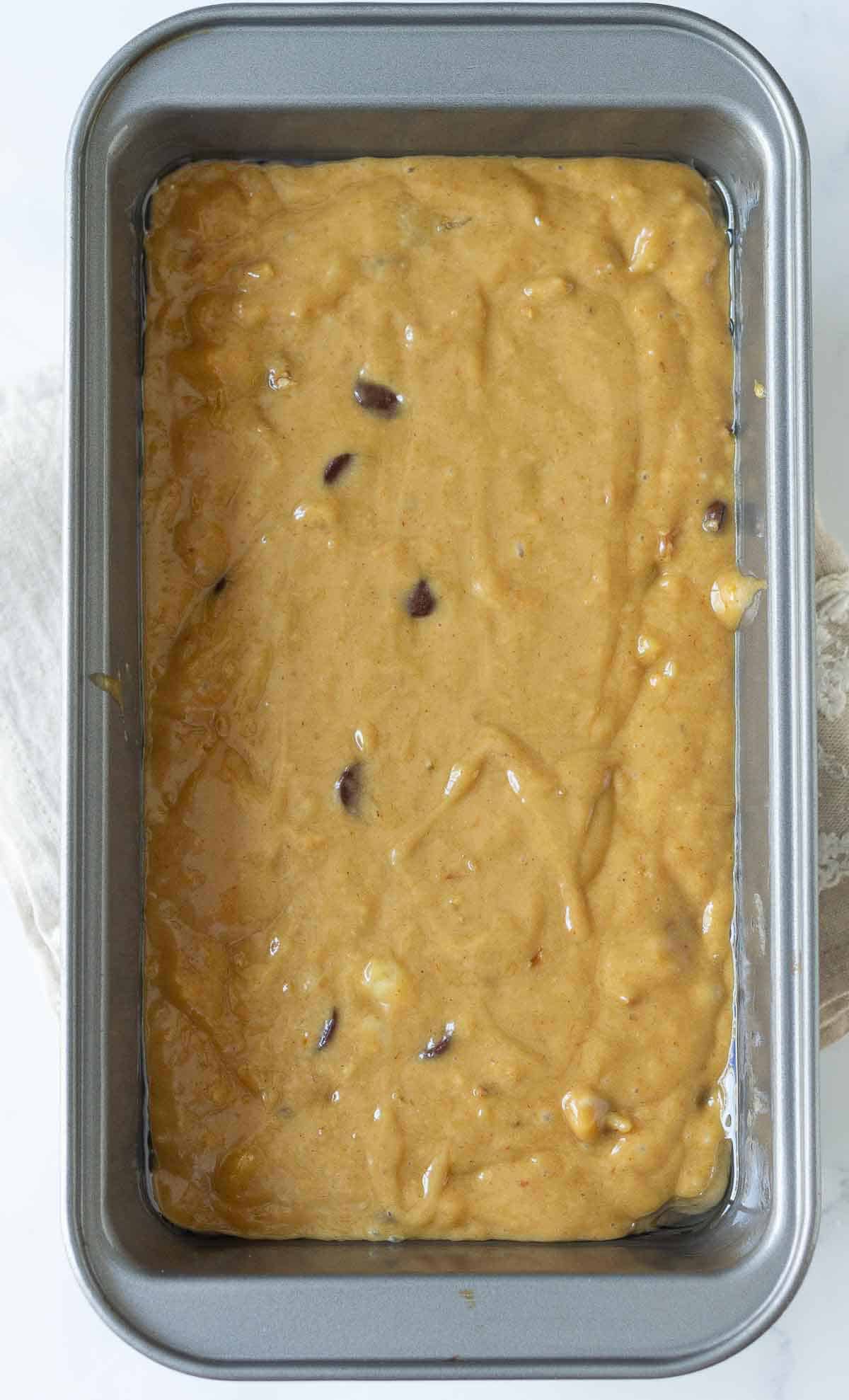 Cake batter in a loaf pan.