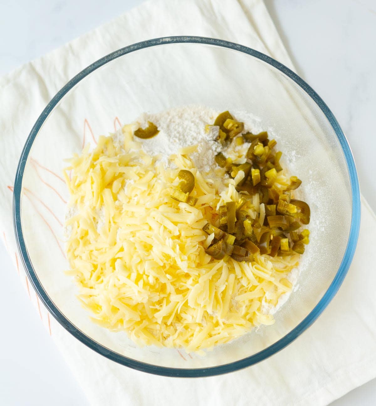 flour, salt, cheese, and jalapenos in a large mixing bowl.