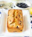 Lemon blueberry bread on a white platter.