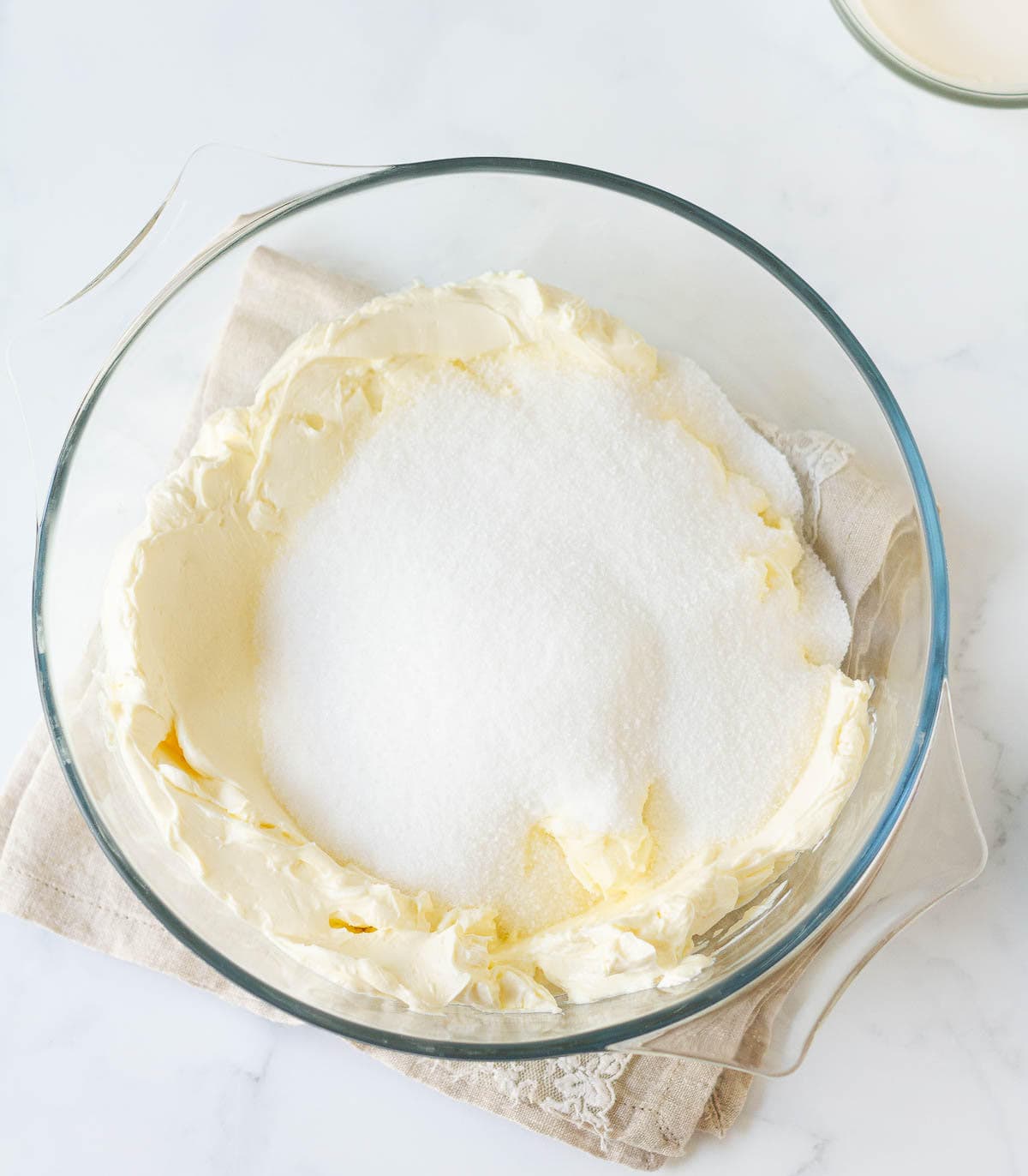 cream cheese and sugar in a mixing bowl.