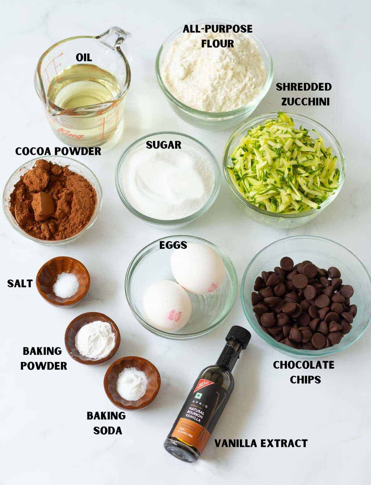 Labelled ingredients for making chocolate zucchini bread.