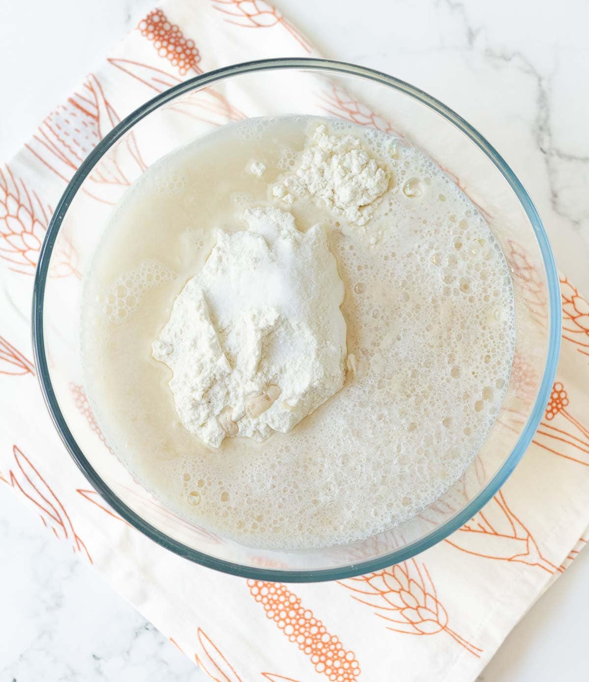 Flour and yeast mixture in a mixing bowl.