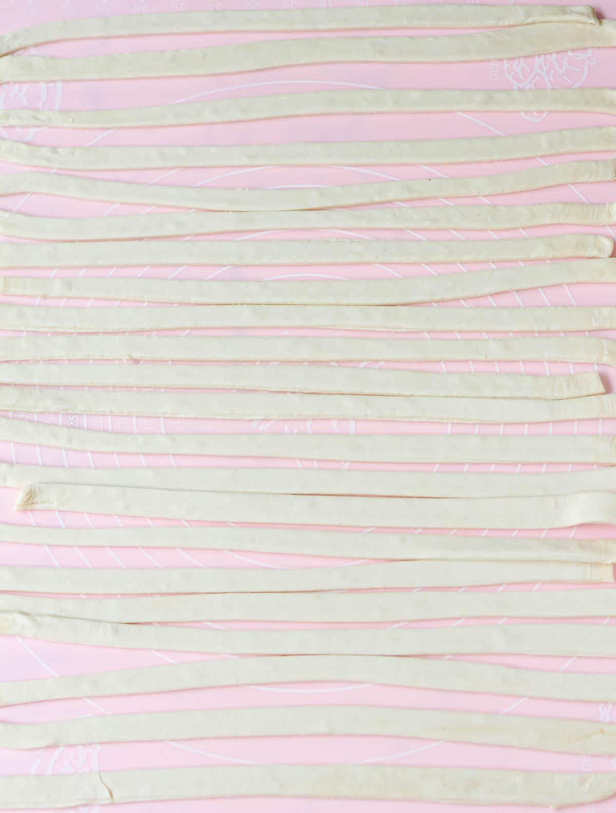 Rolled out pastry cut into strips.