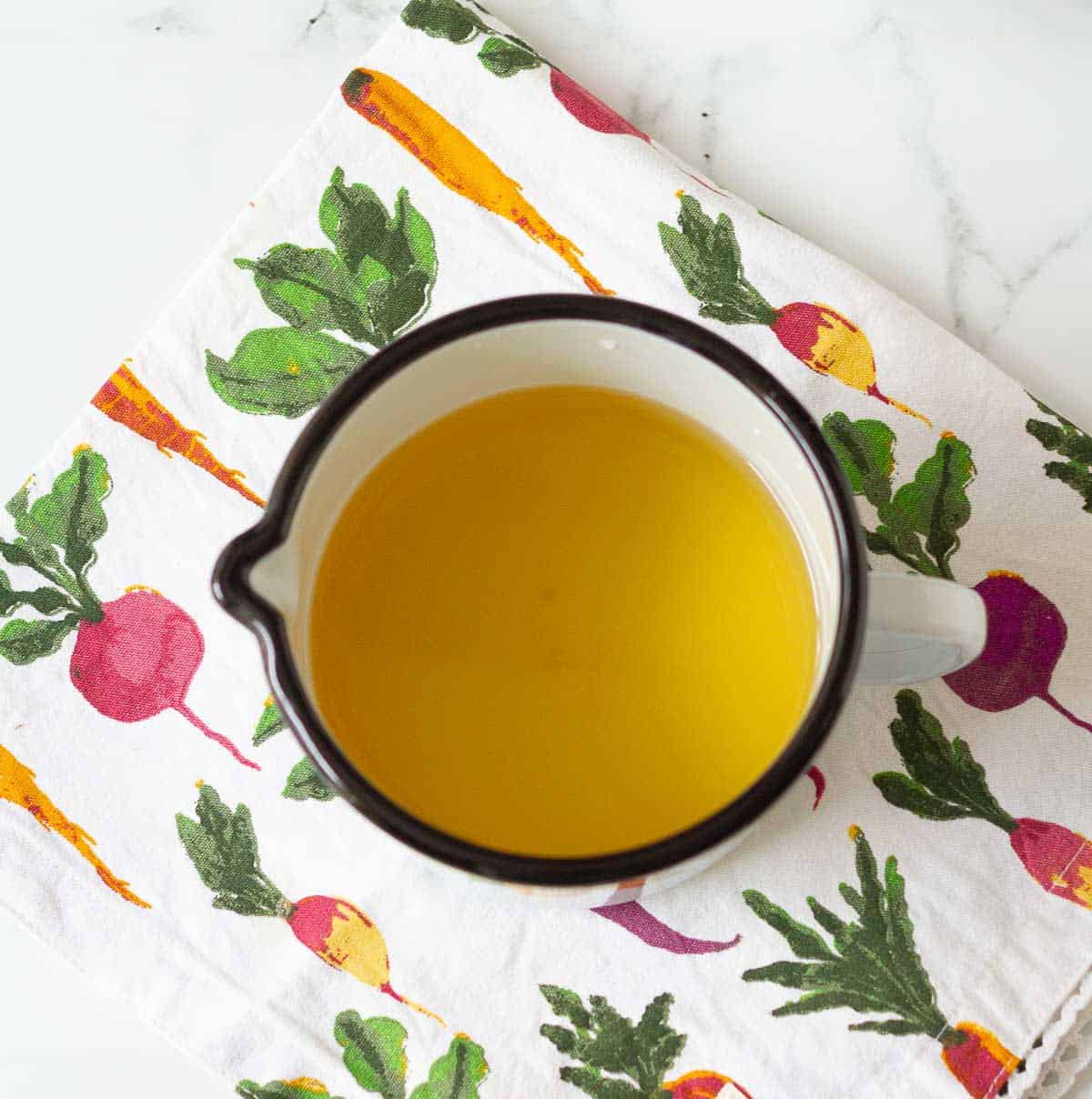 Honey and water in a cup.