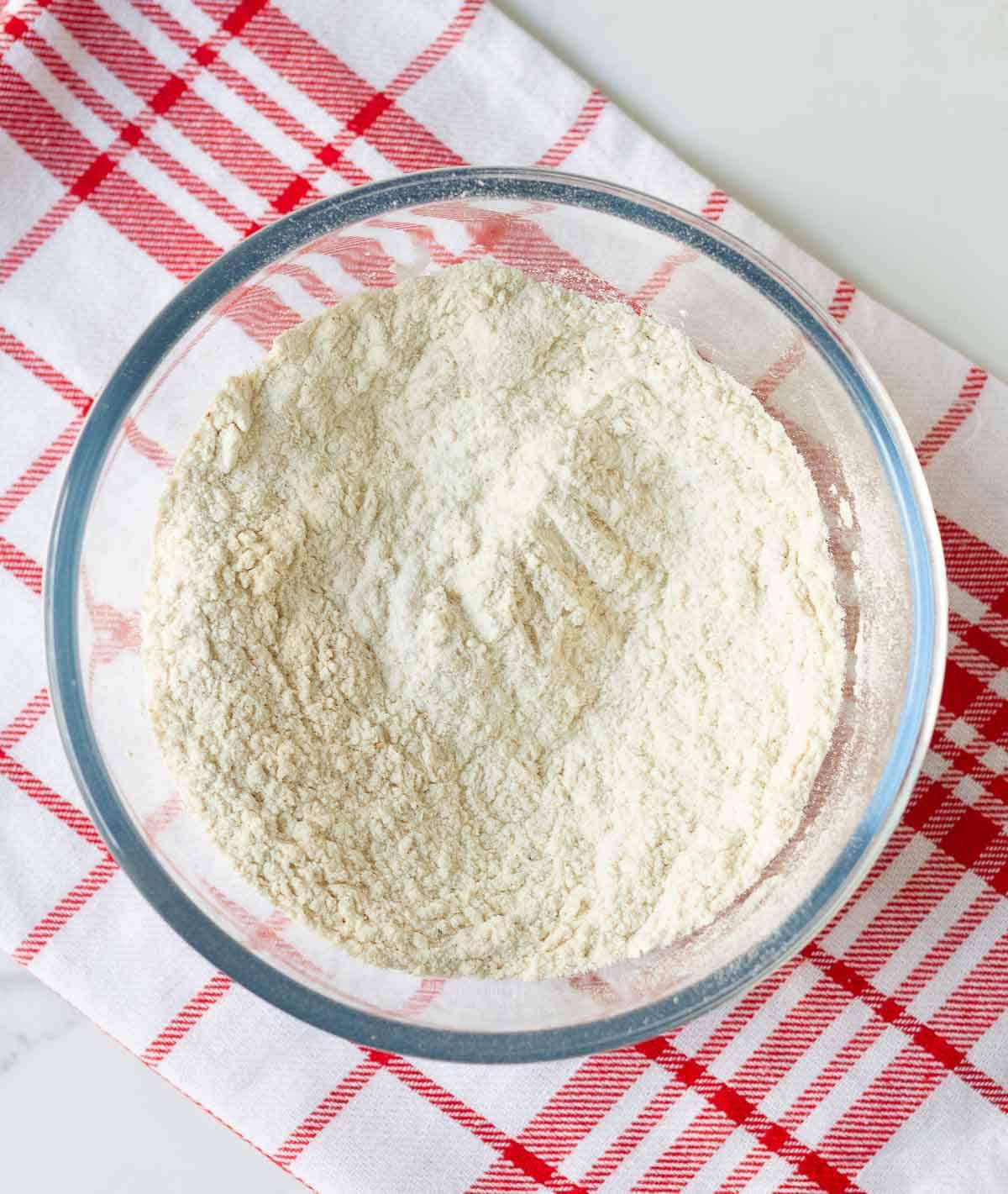 Dry ingredients for making cookies in a mixing bowl.