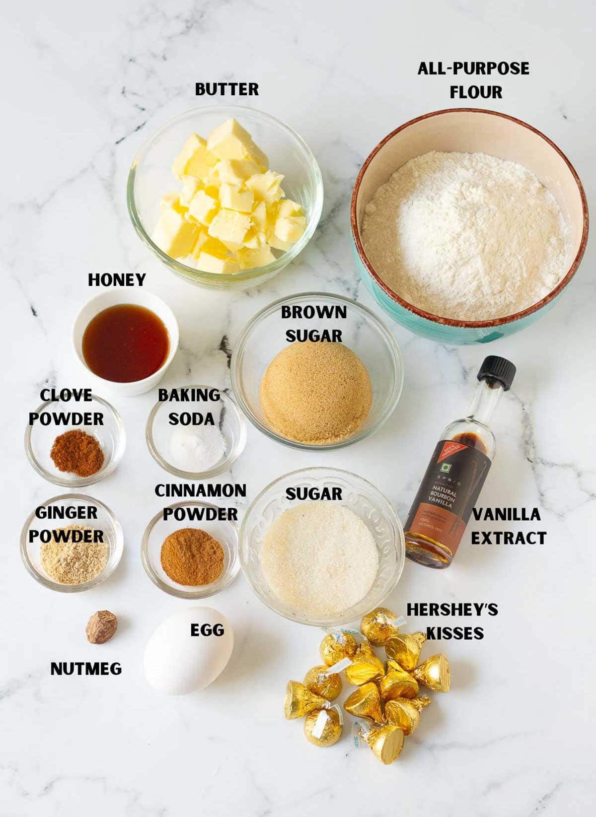 Labelled ingredients for making gingerbread kiss cookies.