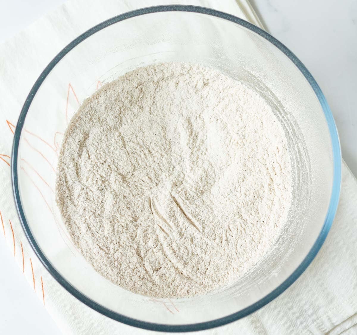 Dry ingredients in a glass bowl.