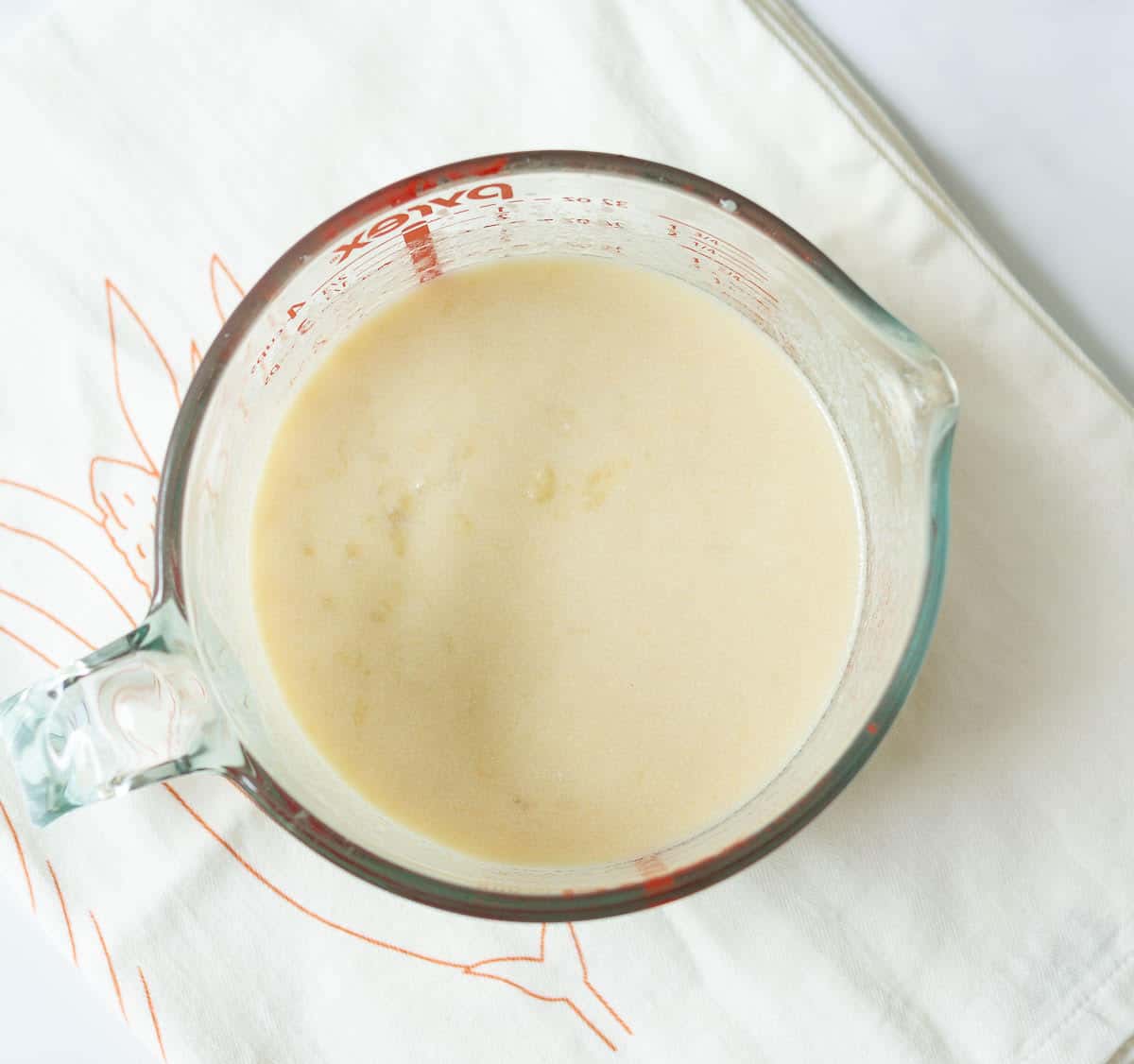 Wet ingredients in a measuring cup.