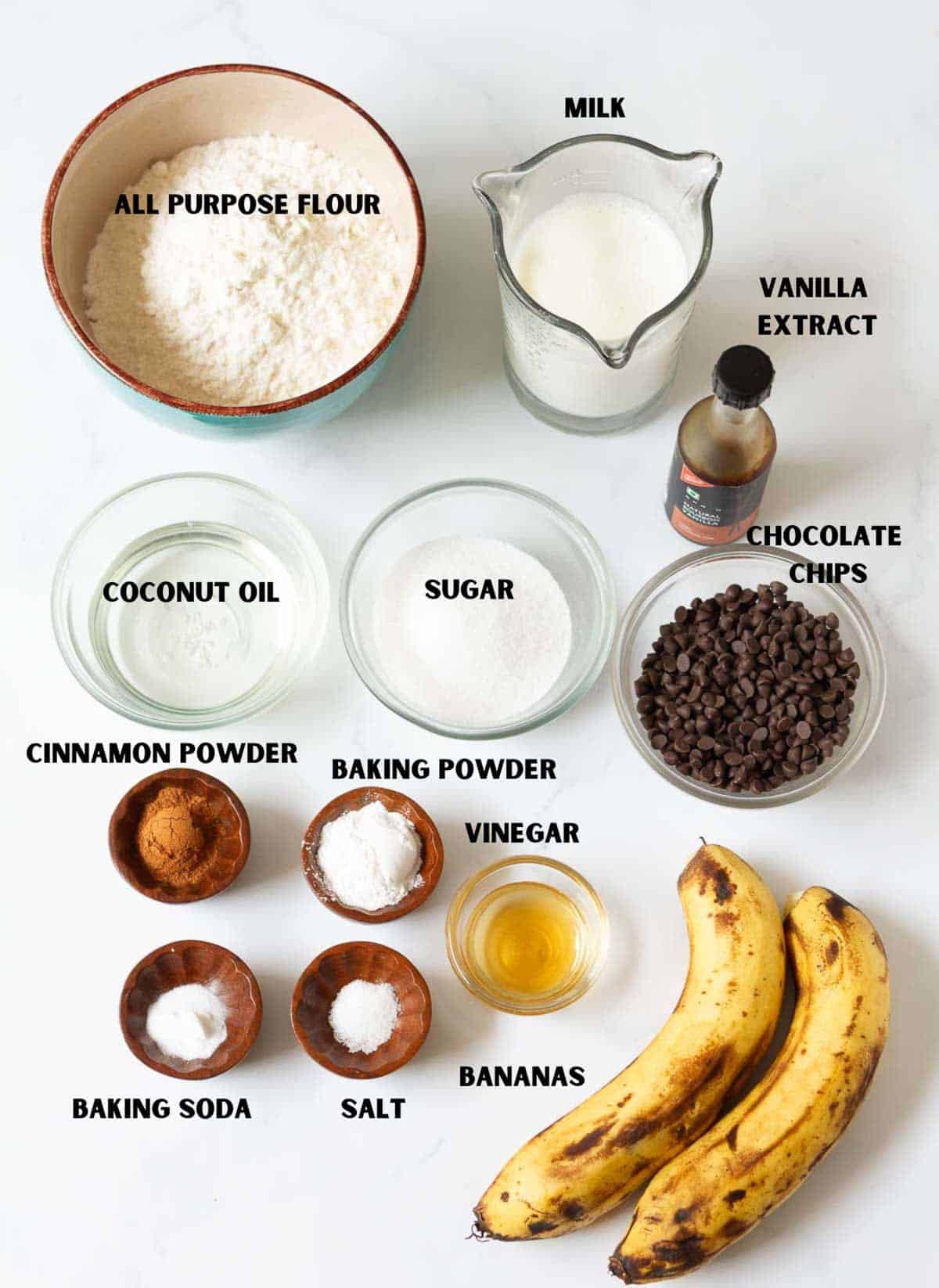 Labelled ingredients for making chocolate chip banana bread.