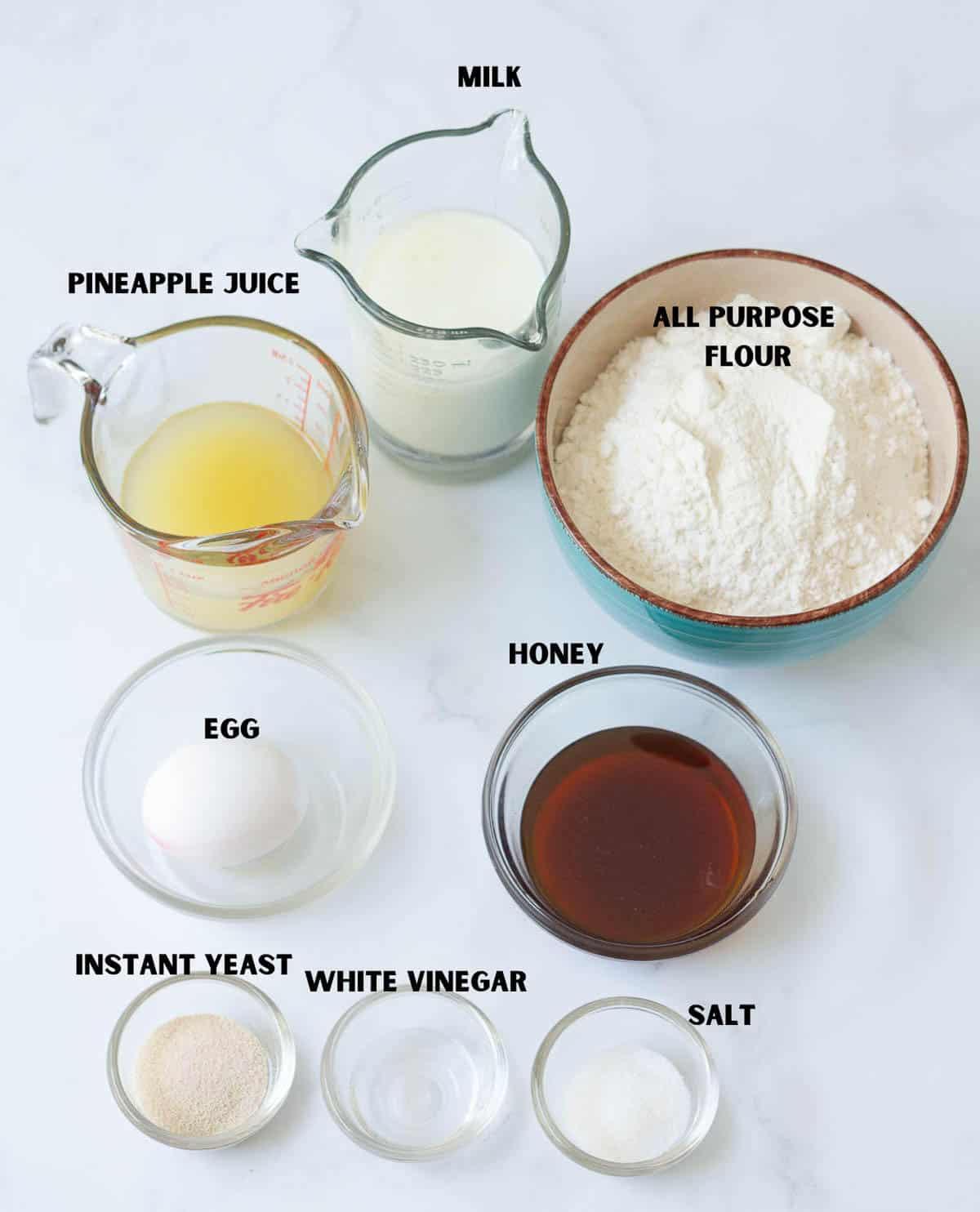Labelled ingredients for making Hawaiian rolls.