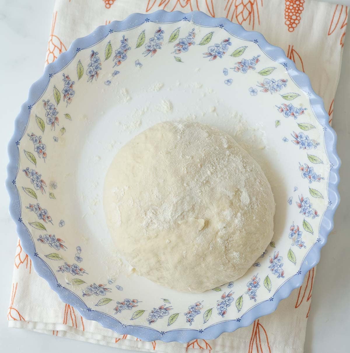 Dough ball in a large bowl.