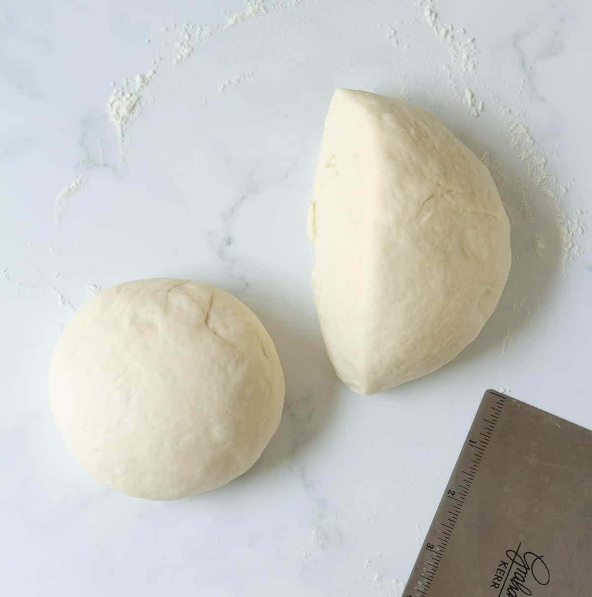 Dough cut it into 2 halves on a surface.