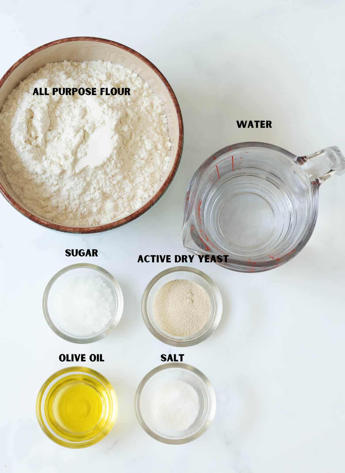 Labelled ingredients for making pizza dough.